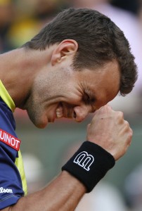 France's Paul-Henri Mathieu celebrates a